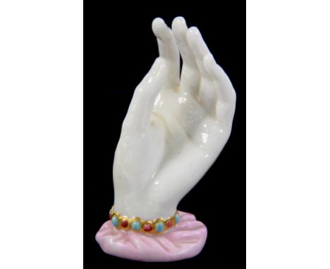 A ROYAL WORCESTER MODEL OF MRS HADLEY'S HAND, ORIGINALLY MODELLED BY JAMES HADLEY AND OF UNUSUAL SMALL SIZE, IN JEWELLED GILT