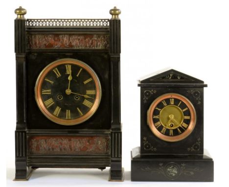 A BRASS MOUNTED NOIR BELGE MANTLE CLOCK, THE CASE SET WITH TWO ELECTROTYPE RELIEFS, HAVING BLACK DIAL AND FRENCH GONG STRIKIN