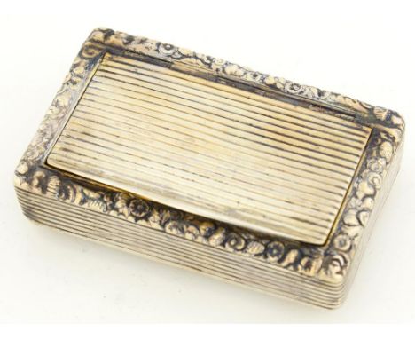 A SILVER SNUFF BOX, WITH FOLIATE CHASED BORDER, THE LID AND SIDES REEDED, 6.5CM W, MARKS INDISTINCT, C1820, 2OZS 