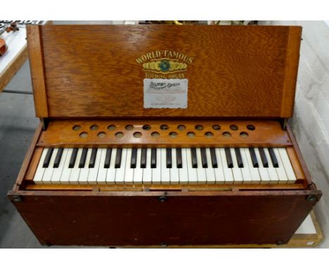 A NORTH AMERICAN PORTABLE HARMONIUM OR REED ORGAN, HAVING GILT TRANSFERS WORLD FAMOUS... FOLDING ORGAN / BILHORN TELESCOPE OR