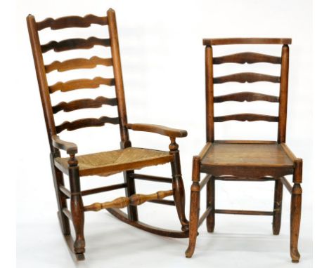 AN ASH LADDER BACK ROCKING CHAIR, RUSH SEATED AND AN ASH LADDER BACK DINING CHAIR WITH BOARDED SEAT, BOTH 19TH C