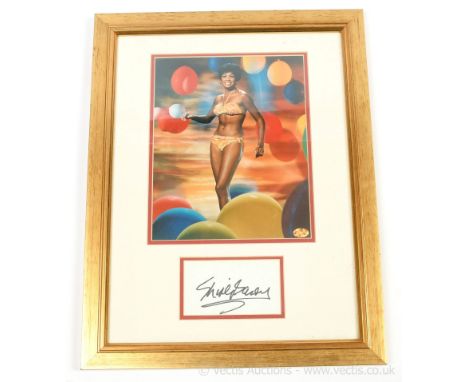 Shirley Bassey framed autograph and colour photo display, with COA, 18"/46cm x 14"/36cm (frame size). NB. if the item needs t