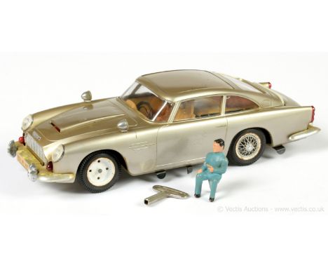 Gama No.4900 "James Bond" plastic and tinplate clockwork Aston Martin DB5, Complete with "villain" figure and original Gama c