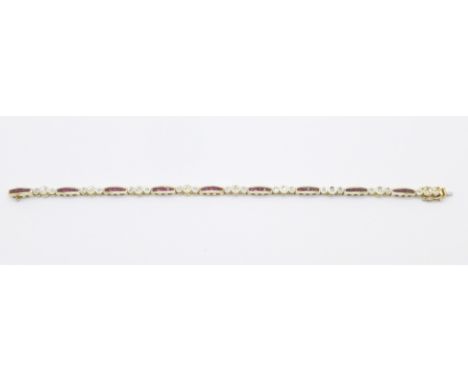 A 14k gold ruby and diamond bracelet, 11.4g 