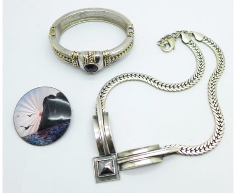 A .925 silver and enamel Aksel Holmsen fjord scene brooch, 43mm, enamel scratched, a bangle and a necklet 