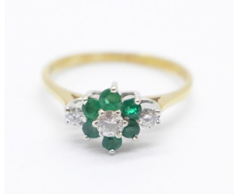 An 18ct gold, emerald and diamond cluster ring, 1.9g, K 