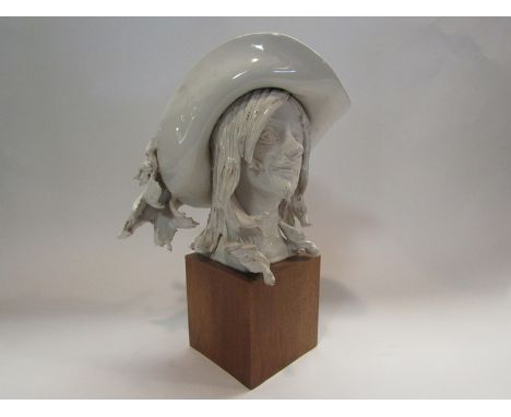 An Italian ceramic bust of D'Artagnan on wooden base, signed R.Cianteli