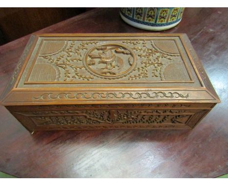 A carved hardwood trinket box and a roll's razor