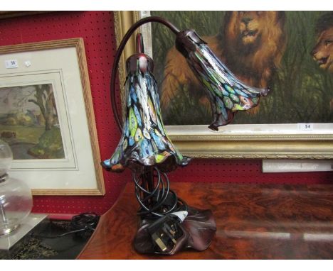 A twin arm table lamp with mottled glass shades on lily pad base