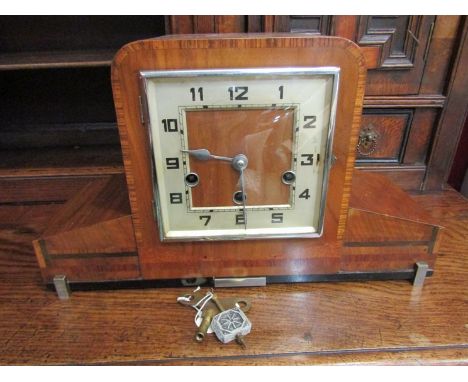 An Art Deco Westminster chime mantel clock with number numerated chapter ring