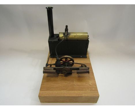 A live steam stationary engine on oak base