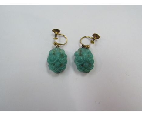 A pair of carved jade drop earrings stamped 9ct