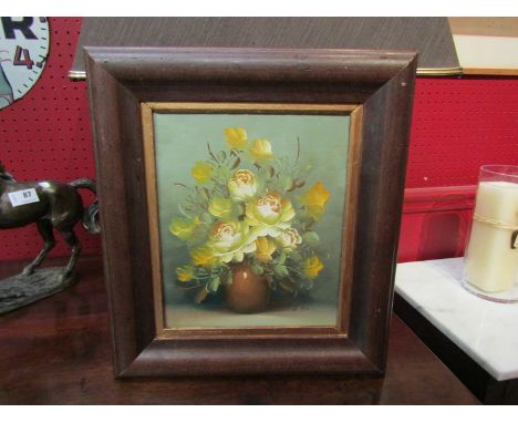 An oil on board by A.Ban of yellow dog roses in a ceramic vase, signed lower right, 25cm x 20cm