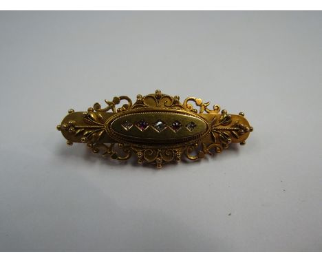 A Victorian 15ct gold, diamond and ruby chip stone brooch, 5g