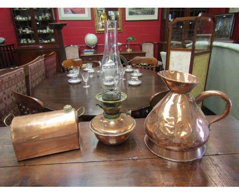 A copper jug, foot warmer and a messenger's oil lamp retailed by Harrods