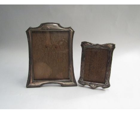 Two silver easel backed photo frames