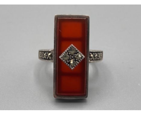 A silver, marcasite and red stone dress ring 6.5g gross size O