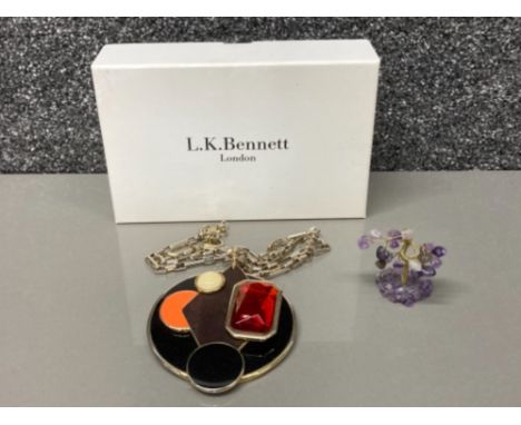 An L K Bennett necklace (boxed) and an amethyst tree sculpture