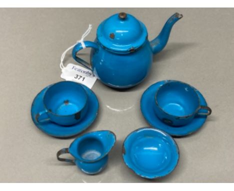 A blue enamel nursery tea set