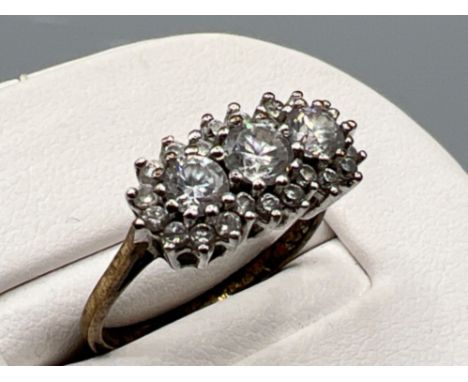 Ladies 9ct gold cz cluster ring. Comprising of 3 round cut stones with a halo setting. 2.8g size N