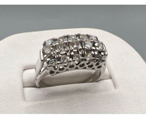 Ladies 18ct white gold diamond cluster ring. Comprising 5 round brilliant cut diamonds And 5 small stones on shoulders. Appro