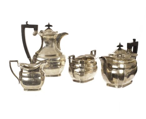 A George V silver four piece coffee and tea service, Sheffield 1934 and by Emile Viner (Viners Ltd.), of serpentine form and 