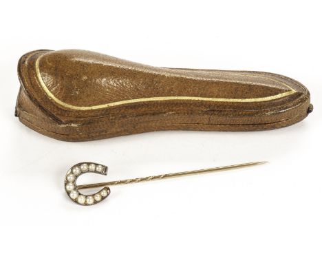 A Victorian gold and pearl stick pin, having a horseshoe set with half cut white pearls on stock pin, in a fitted case (2)