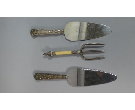 A Collection of Silver Handled Cake Slices and Fork 