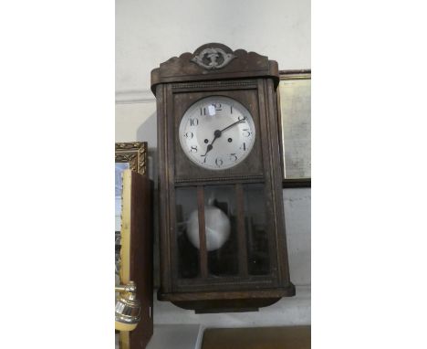 An Edwardian Oak Wall Clock 