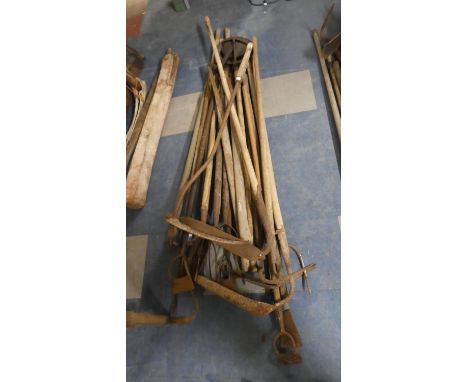 A Collection of Vintage Wooden Long Handled Tools 