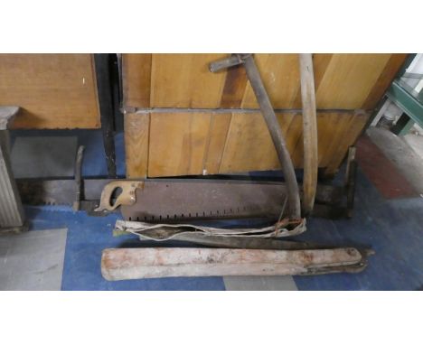 A Collection of Tools to Include Three Cross Cut Saws, Two Scythes and a Cart Jack 