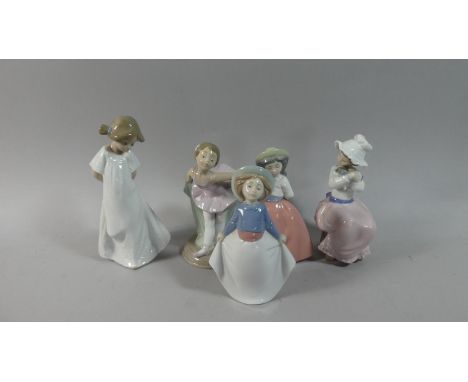 A Collection of Four Plus One Nao Figural Ornaments 