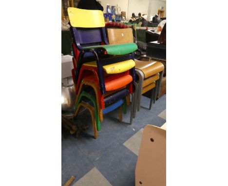 A Set of Five Painted Wooden Stacking Child's Chairs and Three Vintage Stacking Chairs 