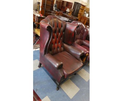 A Nice Quality Button Ox Blood Leather Wing Arm Chair with Brass Studding 