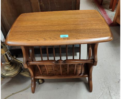 A modern Ercol medium elm occasional table/magazine rack 