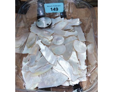 A good selection of Chinese mother of pearl gaming tokens in the form of fish etc 