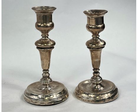 A pair of&nbsp;hallmarked silver candlesticks, London 1920 ( areas of denting/wear) and two&nbsp;hallmarked silver lidded cut