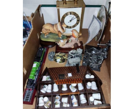 A Large Seiko carriage clock with Whitington &amp; Westminster Chimes; a selection of metal and resin figures; porcelain thim