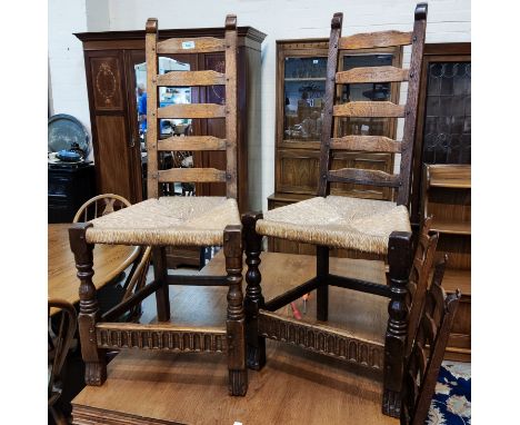 4 high ladder back Arts &amp; Crafts oak dining chairs with rush seats bearing carved bee/beetle mark to legs 
