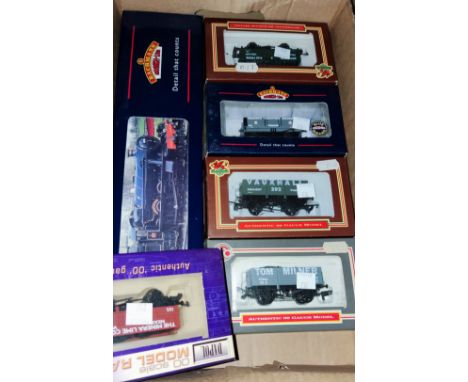 An original boxed Bachmann 00 gauge locomotive 31-777 "Soughton Hall", 4 Dapol + 1 Bachmann boxed waggons. 