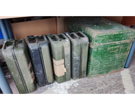 Four vintage petrol cans; a tin trunk 