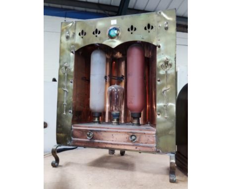 An Art Nouveau unusual grate fitting electric fire in embossed brass (sold as a collectors item only) 