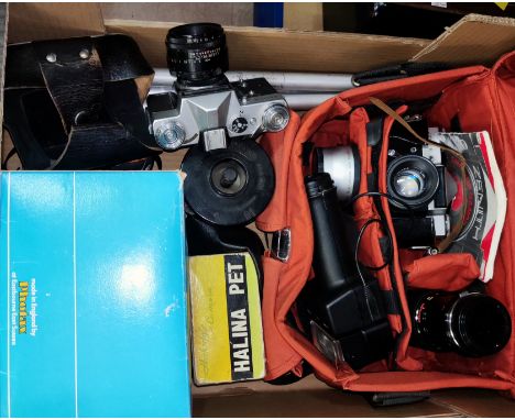 A selection of assorted vintage SLR cameras, Zenit-E lenses, tripods etc 