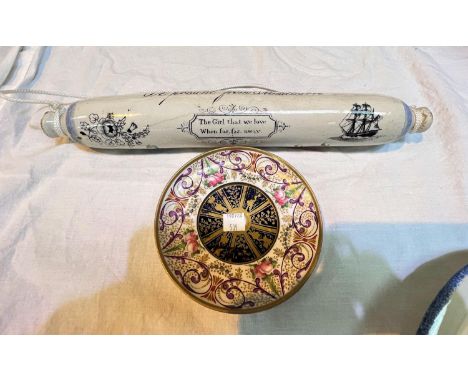 A 19th century ceramic rolling pin decorated with flowers and 'A present from Middleton' 'The Girl that we love far far away'