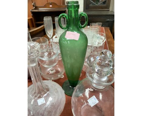 An unusual green glass vase with double handles and tapering shape; two etched decanters and another; a Studio vase and Victo