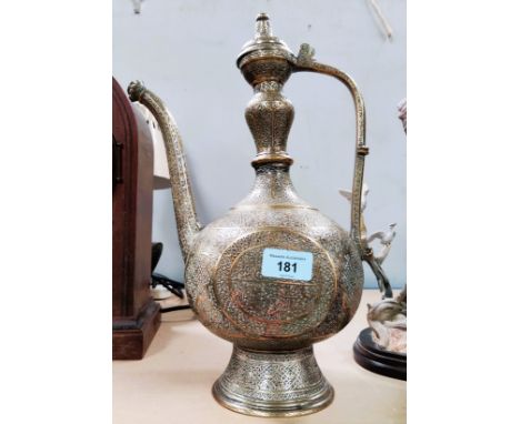 A large brass teapot / jug with extensive decoration, height 36cm 