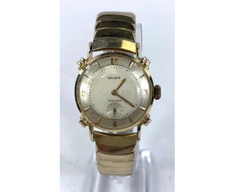 A gent's vintage Gruen gold wristwatch, circa 1960, on expanding strap, stamped 'Gruen 14K gold'.&nbsp;&nbsp;Watch wind and t