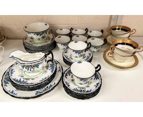 A 1930's Royal Doulton part tea service, 34 pieces approx; a Royal Doulton 12 piece part tea service in gilt and blue 