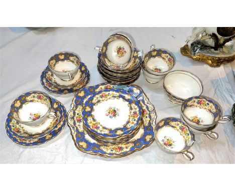 A Paragon Pompadour part tea service with powder blue and floral decoration, approx 32 pieces.&nbsp;&nbsp;Hairline crack to s