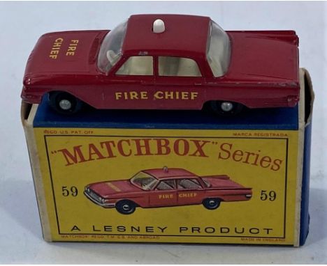 A vintage boxed Matchbox Fire Chief White light 
